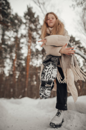 girl having fun in the winter forest. high quality photoの写真素材