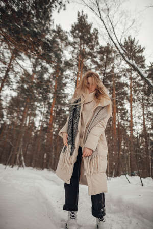 girl having fun in the winter forest. high quality photoの写真素材