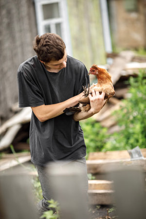 local agriculture, farmers day 12 october. chicken and turkey in the hands of a man, natural products with their own hands.の写真素材