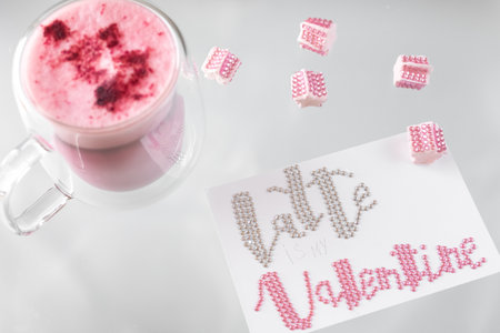 Double-walled glass thermocup with beetroot latte, pink latte is a fashionable and relevant alternative to coffee. giving up caffeine in favor of a healthy lifestyle. Rhinestones on the marmeshow.の写真素材