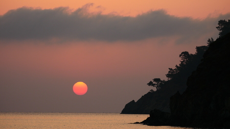 Sunrise silhouette above sea and sky Turkeyの写真素材