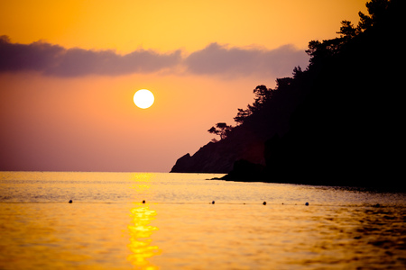 Sunrise silhouette above sea and sky Turkeyの写真素材
