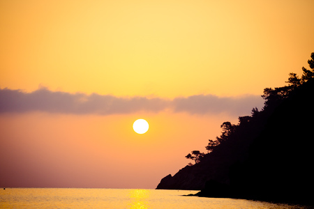 Sunrise silhouette above sea and sky Turkeyの写真素材