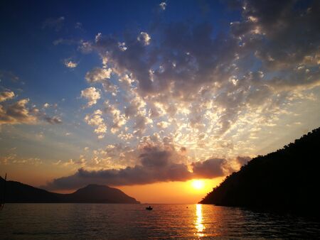Seacost Rythm on sand with wave on sea coast at sunsetの写真素材