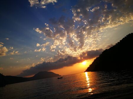 Seacost Rythm on sand with wave on sea coast at sunsetの写真素材