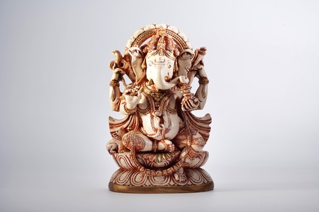 Ganesha sculpture indian lord ancient at white backgroundの写真素材