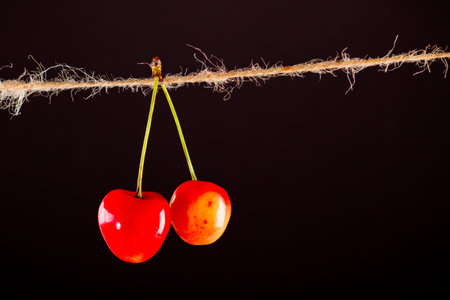 Cherry and rope on black with clamp