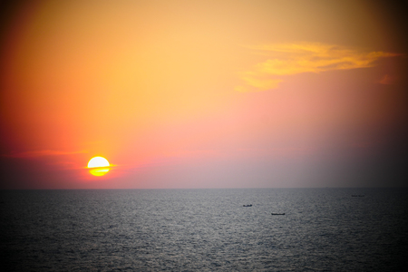 Bougainvillea and Orange Sunset above ocean Keralaの写真素材