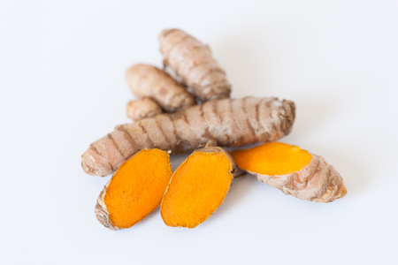 Turmeric roots isolated on white backgroundの写真素材