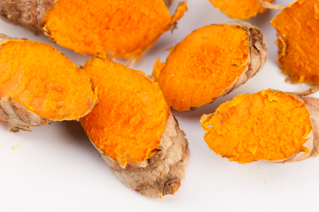 Turmeric roots isolated on white backgroundの写真素材