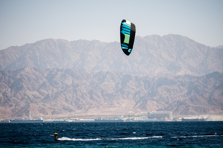 kiter in the surrounding of turquoise sea kiting Israelの写真素材