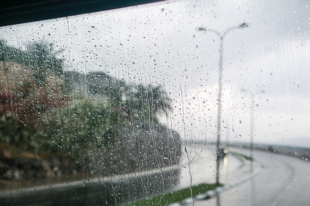 Israel rain view to street through rain-specked windowの写真素材