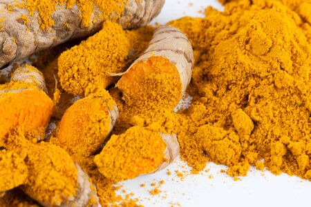 Turmeric roots isolated on white backgroundの写真素材