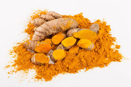 Turmeric roots isolated on white backgroundの写真素材