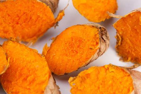 Turmeric roots isolated on white backgroundの写真素材