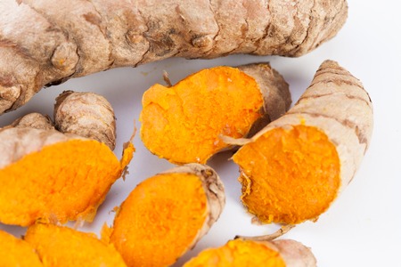 Turmeric roots isolated on white backgroundの写真素材