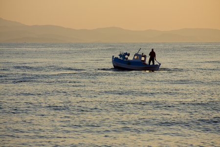 Sunset boat golden seaの写真素材