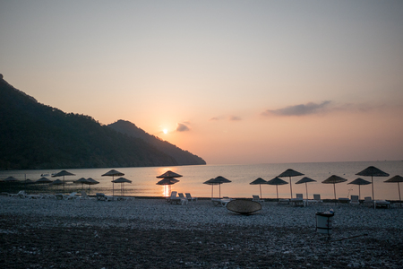 Sunrise silhouette on the beach Turkeyの写真素材