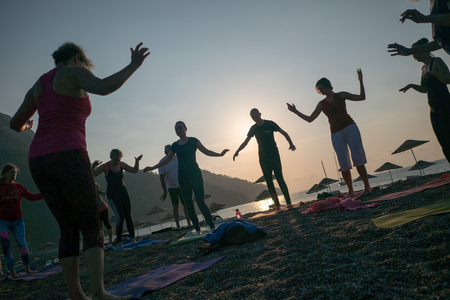 Yoga on the beach ANTALYA, TURKEY - JUNE 25, 2017のeditorial素材