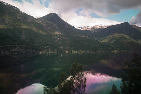 Fjord reflection in clear water in Norwayの写真素材