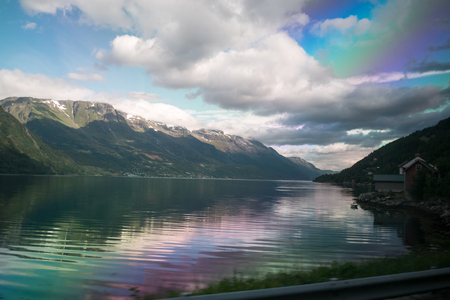 Fjord reflection in clear water in Norwayの写真素材