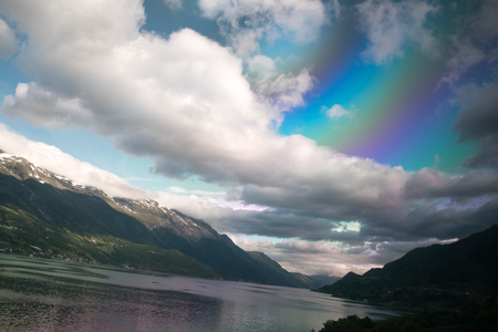 Fjord reflection in clear water in Norwayの写真素材