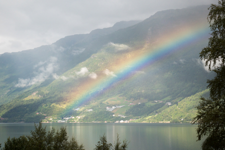 The view on the narrowest fjord in Norway with rainbowの写真素材