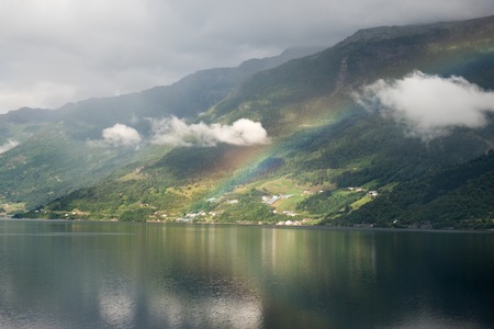 The view on the narrowest fjord in Norway with rainbowの写真素材