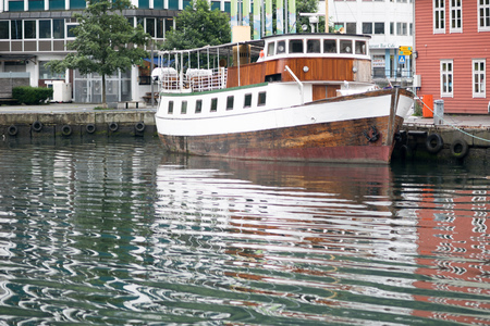 Boat in Norway with reflection in water summer timeの写真素材