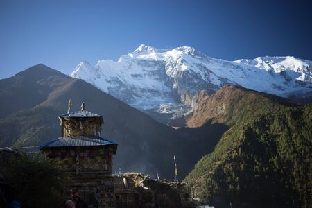 Buddhist gompa and prayer flags in the Himalaya mountains, Nepalの写真素材