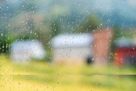 Nepal road rain view to street through rain-specked windowの写真素材