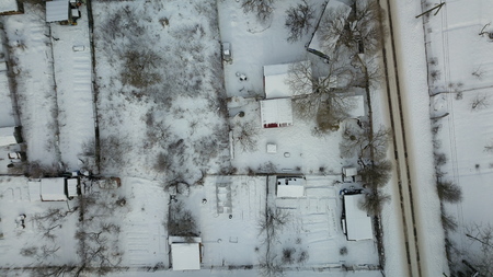 Aerial view of winter frozen forest covered in snowの写真素材