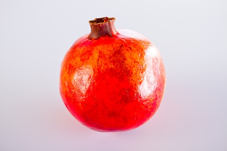 red pomegranate on white backgroundの写真素材