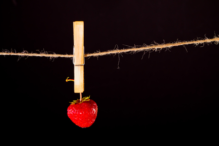 Cherry and rope on black with clampの写真素材