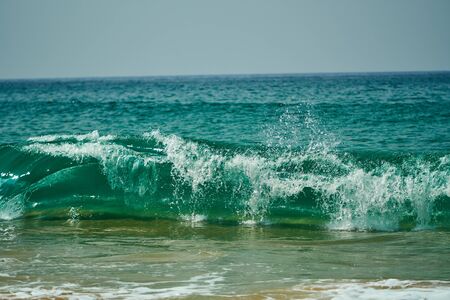 Ocean coast with big waves and rocksの写真素材