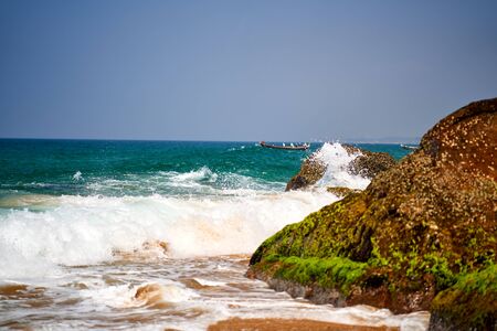 Ocean coast with big waves and rocksの写真素材