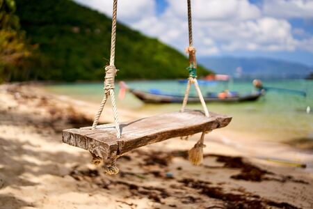Swing at a tropical beach in Thailandの写真素材