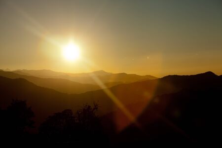 Sunrise above peak in the Himalaya range, Nepalの写真素材