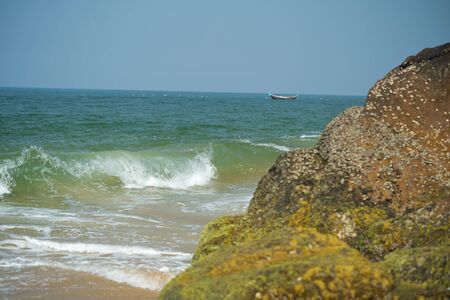 Palm and Ocean coast with big waves in Indiaの写真素材