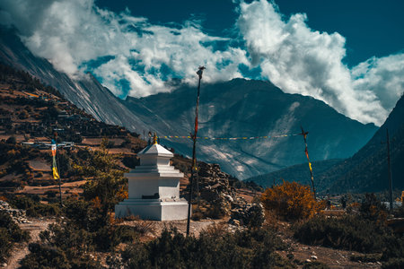 Buddhist gompa and prayer flags in the Himalaya mountains, Nepalの写真素材