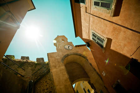 Old clock on the tower and sunの写真素材