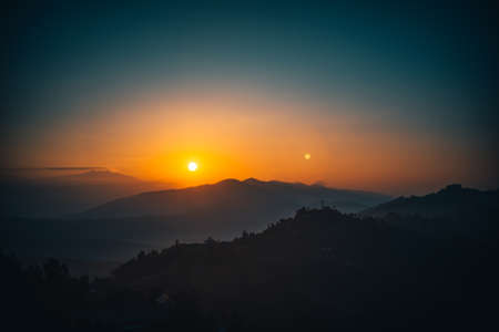 Sunset above valley Buddhist monastery Nepal in the Himalaya mountainsの写真素材