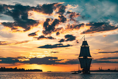 The Frigate Shtandar in calm weather sailing sunset time Riga Latviaの写真素材