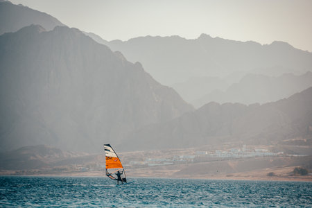 Kite surfing in Dahab Egypt. Exploring the blue water with mountainsの写真素材