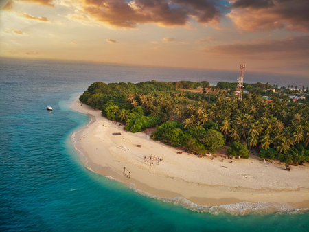 Tropical paradise with blue sea and green island in the maldivesの写真素材