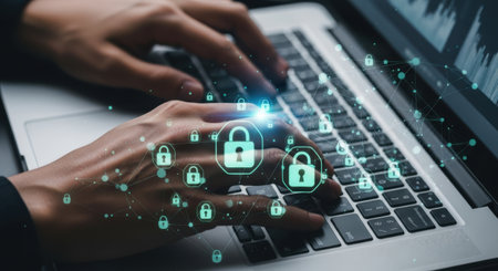 A close-up of hands typing on a laptop keyboard, with glowing green digital padlock icons symbolizing cybersecurity and data protection.の素材