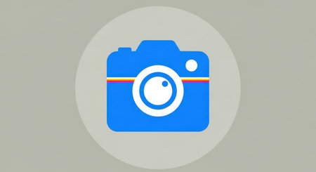 A bright blue camera icon with a white lens is centrally placed within a light gray oval on a textured gray background.の素材