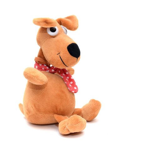Toy red cute funny dog on a white isolated background