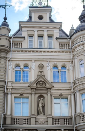 Russia, Kazan, April 27, 2018: a beautiful fragment of the facade of a modern building with statues in the old vintage European styleのeditorial素材