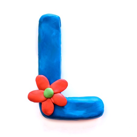 Blue plasticine letter L with red flower, isolate on white backgroundの写真素材